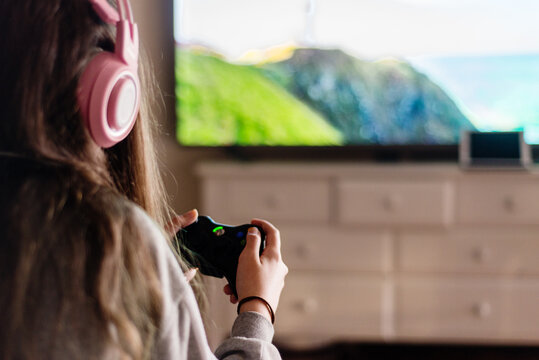 young female gamer at home
