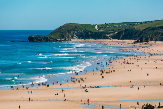 Unrecognizable people having fun in a sandy beach
