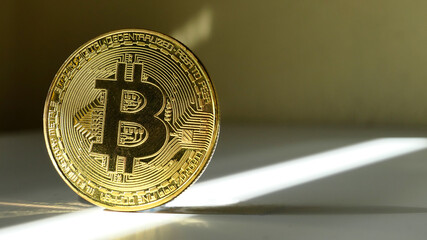 Cryptocurrency bitcoin. Gold color coin.