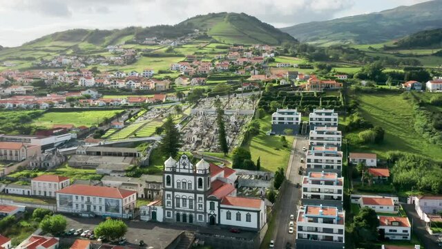 Horta, Faial Island, Azores, Portugal. The centre of Horta, with a view that includes the Carmo Church. Aerial footage of a typical insular Portuguese coastal community. High quality 4k footage