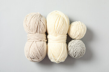 Soft colorful woolen yarns on white background, flat lay