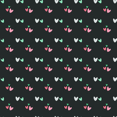 Seamless pattern with hearts in pastel colors on a dark background.Vector illustration.Great for fabrics, wallpapers, textiles, packaging. 
