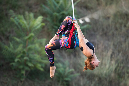 Woman dancing on slackline highline