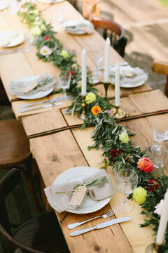 beautiful table setting with cheese platter, flowers, linen napkins, name tags and other goodness