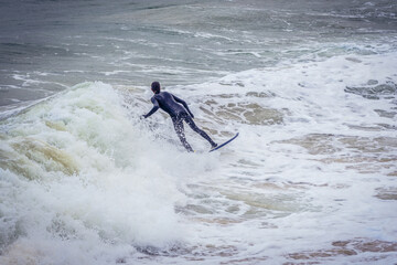 Fototapeta premium Surfer on La Concha Bay in San Sebastian city also known as Donostia, Spain