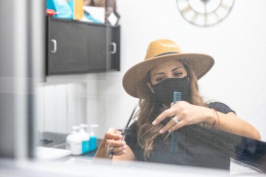 Style: Stylist Wearing Face Mask Trims Customer's Hair With Scis
