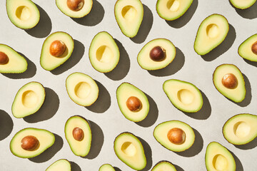 Halves of avocados with and without seeds