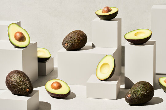 Fototapeta Composition of ripe avocados and cubes