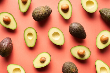 Whole and cut avocados background