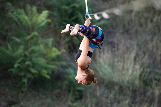 Woman dancing on slackline highline