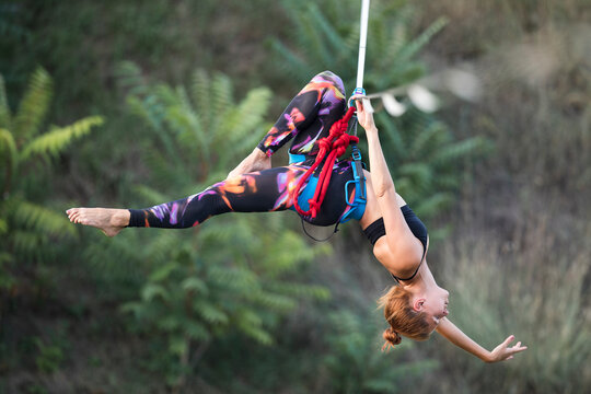 Woman dancing on slackline highline