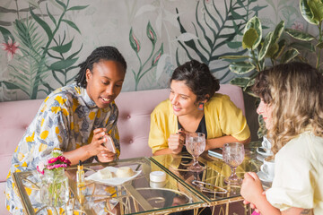 Group Of Multiethnic Businesswomen Looking At The Phone