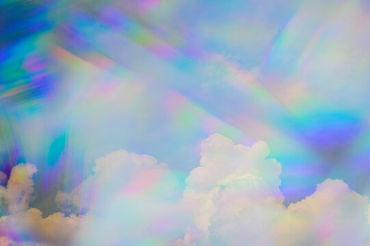 Prism against Fluffy Clouds in Sky
