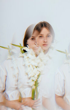 Reflections of woman with flowers