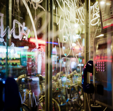City lights at night view from a phone cabine in Paris