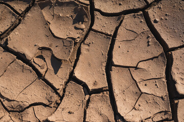 very cracked dry mud texture