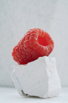 Macro Shot Of A Raspberry On The White Opal Stone