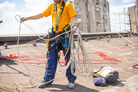 Working at elevations. Rope access, high-altitude outdoor work.