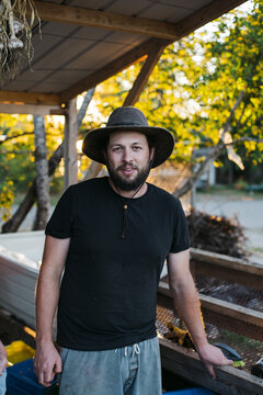 Portrait of young man in farm shed