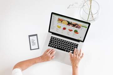 Customer buying grocery online on laptop