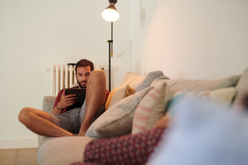Man relaxing on sofa