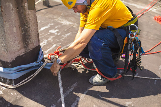 Working at elevations. Rope access, high-altitude outdoor work.