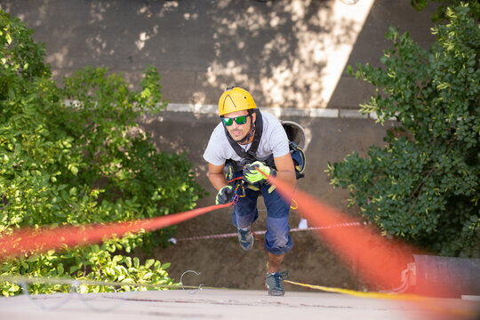 Working at elevations. Rope access, high-altitude outdoor work.