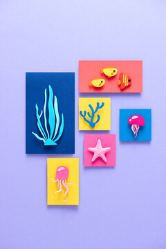 Sea life paper cut on lilac background