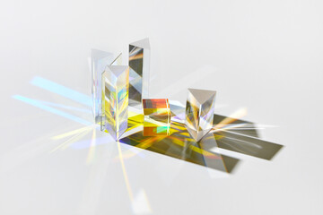 Geometric glass figures with light spectrum refraction.