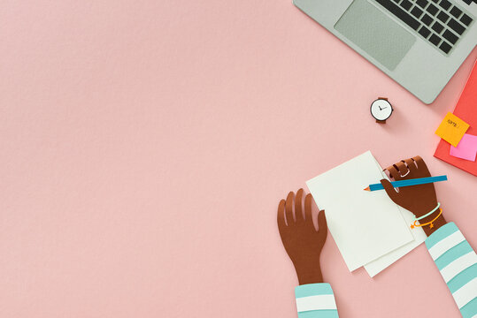 Woman hands writing in notebook, digital work, view from above. Creative workplace in office