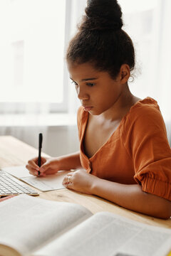 Serious African American Girl Doing Home Task