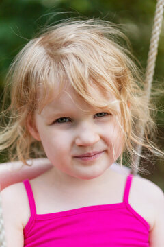 Toddler relaxing in swing