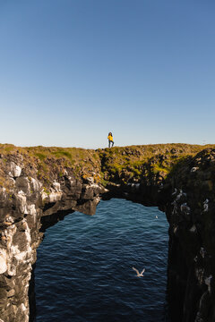 Girl standing on a cliff