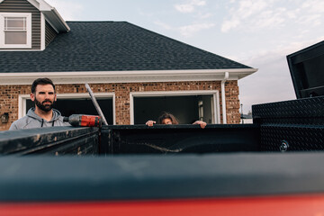 Dad doing chores with daughter.