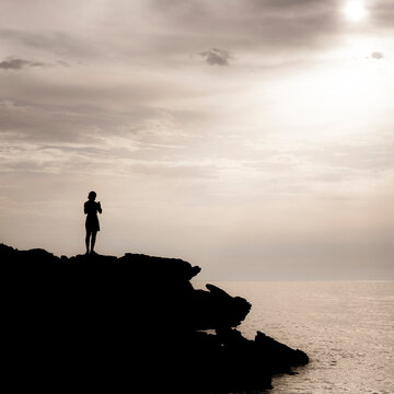 silhouette at the sunset to the sea