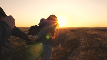 Happy smiling girl walks at sunset and laughs. It's fun to travel together. Camping life. Look for adventure travel. Love for nature and life. Enjoy and breathe fresh air. Evening sports walks park