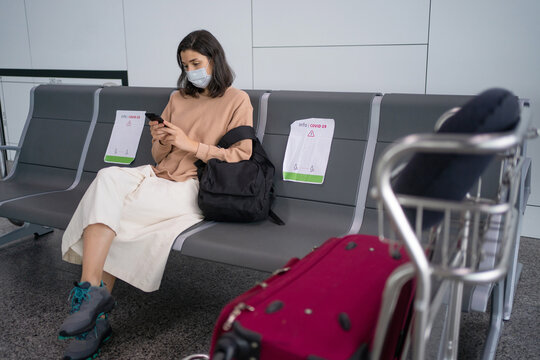 Traveler With Mask Waiting In The Airport.
