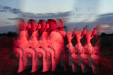 Kaleidoscop. Colorful fashion portrait of trendy woman in minimalist clothes posing outdors under neon light