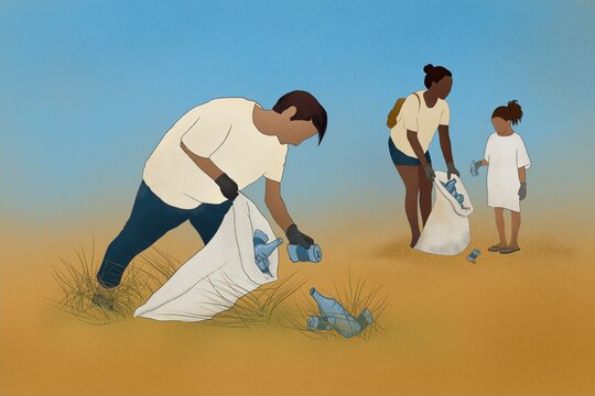 Teenage environmentalist and volunteers picking up beach trash