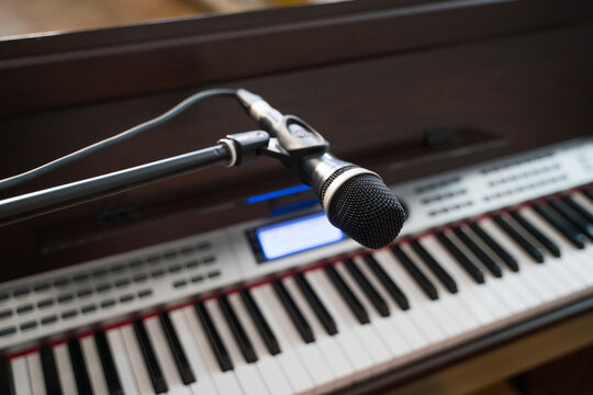 Crop View Piano And Microphone At Home