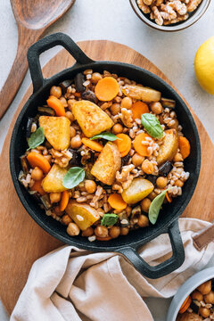 Spelt salad with roasted potatoes, chickpeas, carrots, aubergine