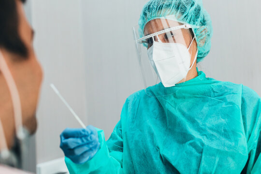 Medic performing a nasal PCR test on a patient