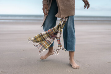 Anonymous Black Woman in a Fall Beach