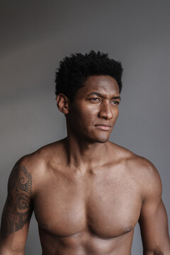 Portrait Of Shirtless Man With Tattoo
