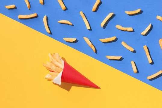 french fries in paper containers near french fries seamless pattern