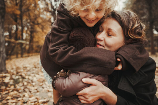 Family walking in autumn park. - Powered by Adobe