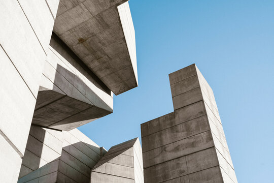 Minimal concrete geometrical architectural structures against blue sky