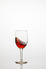Wine transparent glass with red grape wine.