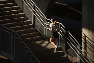 Woman running upstairs