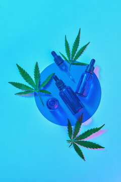 Bottles of oil with marijuana leaves and glitch effect.